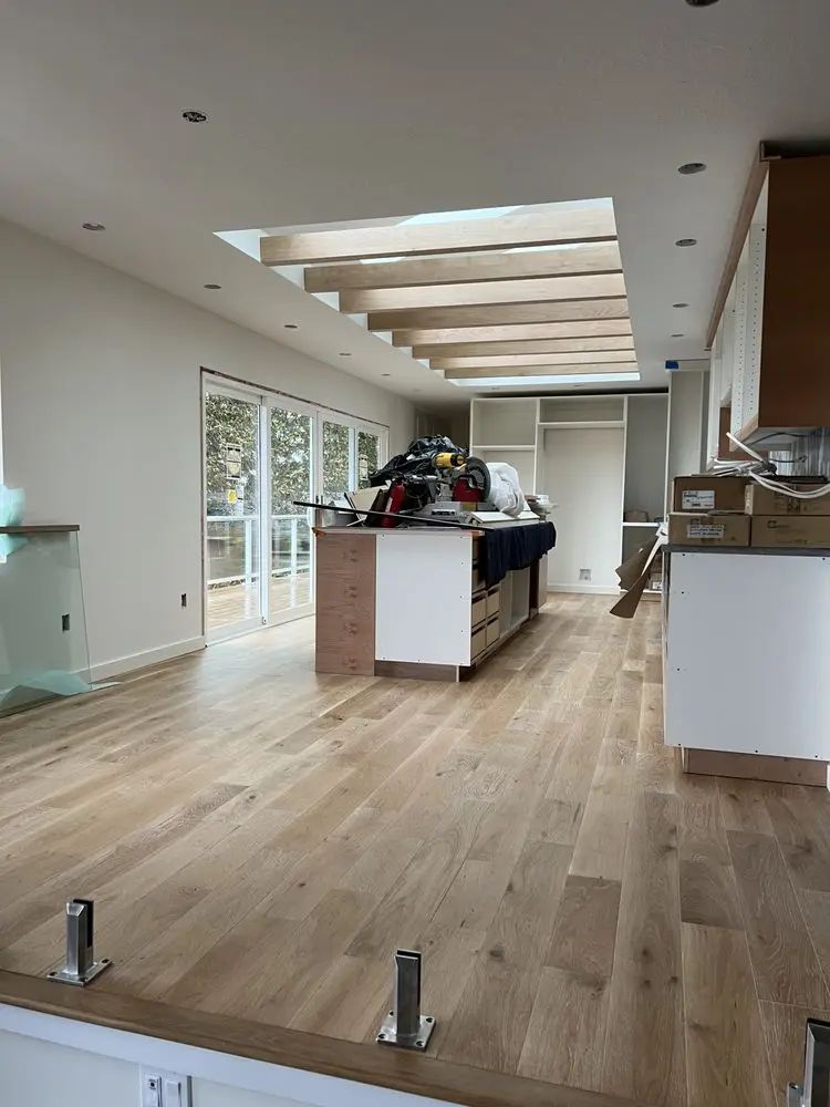 Flooring through a kitchen by FED Builder