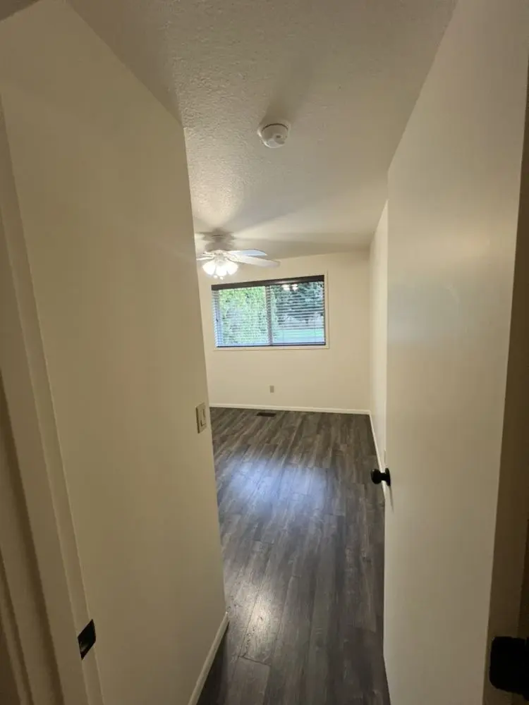 New flooring down a hallway by FED Builder