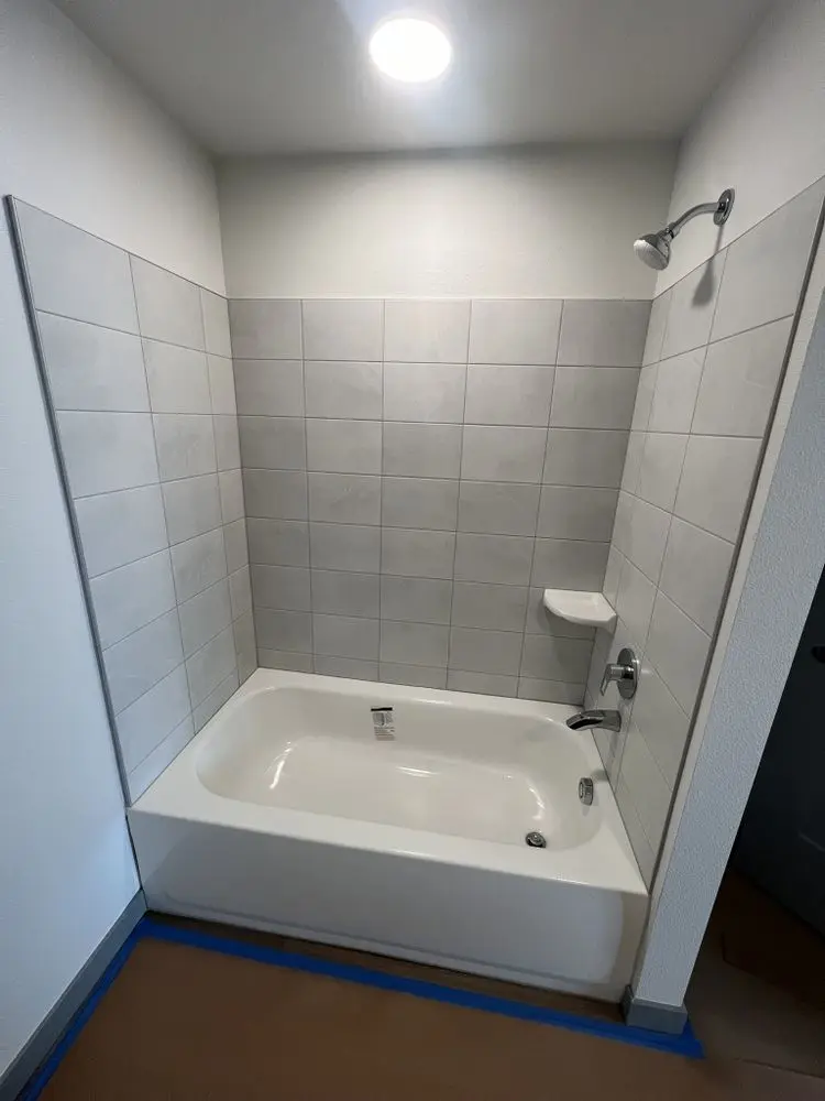Tiled shower and tub by FED Builder