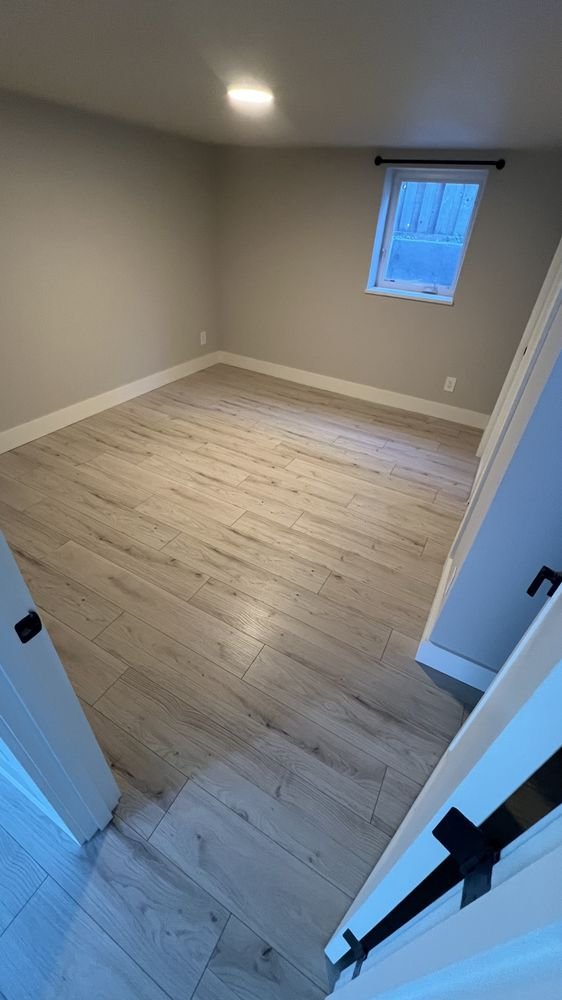 Basement Flood Restoration – New Laminate Flooring